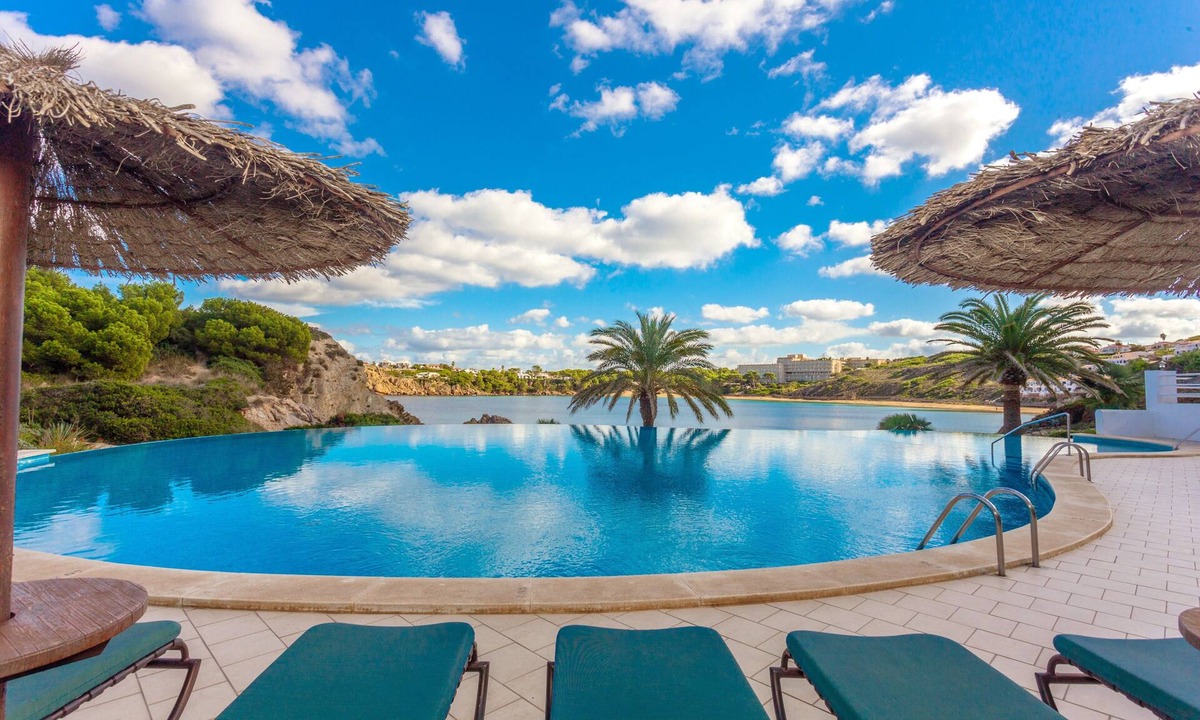 Arenal d'en Castell Apartment | Apartment "White Sands 613" close to the Beach with Sea View, Pool & Wi-Fi