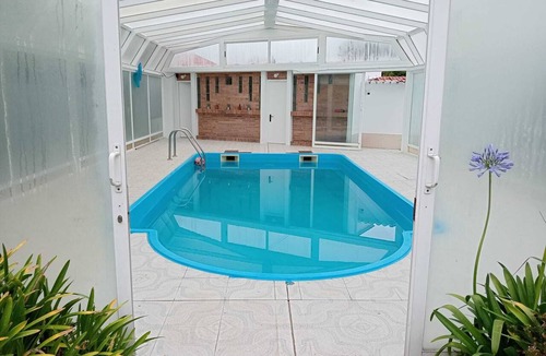 Sada Ski Chalet | Cumbre Chalet in Sada with a pool and views of Sada