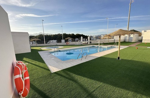 San Juan de los Terreros House | Holiday Home "Adosado El Invencible" with Sea View, Shared Pool & Wi-Fi