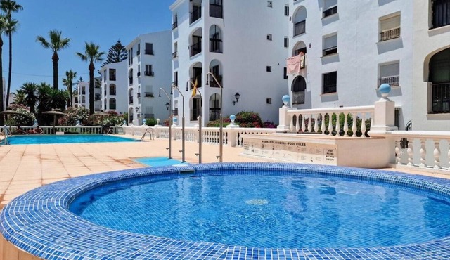 Beautiful beachfront 2 bedroom apartment with garage, swimming pool, fast wifi, garden, 30m to beach