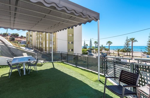 Benajarafe Apartment | Beachfront Apartment with Air Conditioning, Stunning Views, Terrace, and Wi-Fi